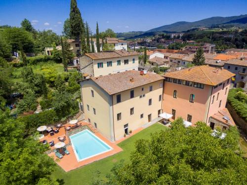 an aerial view of a large house with a swimming pool at Antico Pastificio in Greve in Chianti