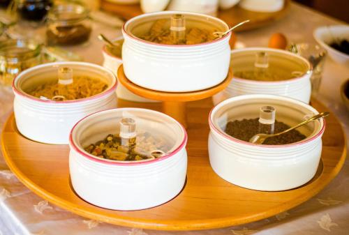 a group of canning jars of food on a table at Hotel St. Pankraz in San Pancrazio dʼUltimo