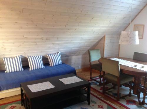 a bedroom with a bed and a desk and a table at Stevns Klint Bed & Breakfast in Store Heddinge