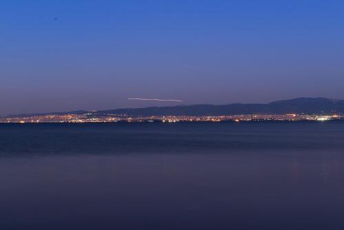 a view of a large body of water at night at Hotel Pithari in Agia Triada