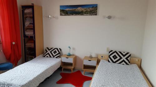 a room with two beds and a star on the floor at entre mer et verdon in Draguignan