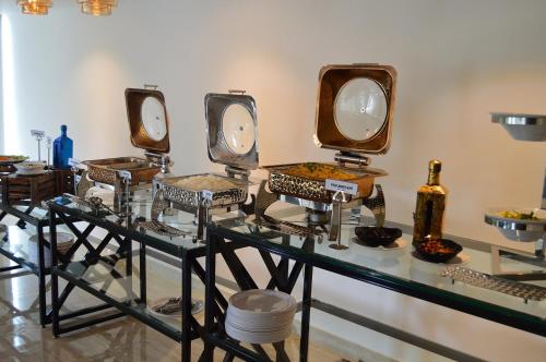 a group of mirrors on display in a room at Vivid A Boutique Hotel in Tiruchchirāppalli