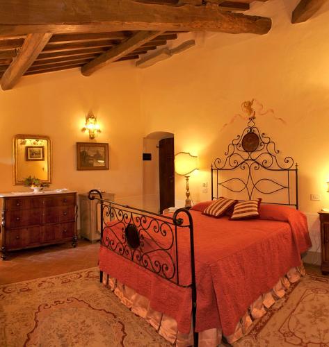 Ένα ή περισσότερα κρεβάτια σε δωμάτιο στο Relais Villa Baldelli