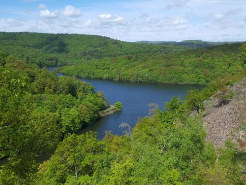 an aerial view of a river in a valley at Ferienwohnungen Finke in Frankenau