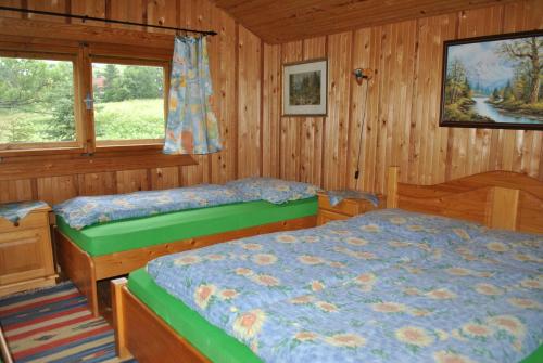 Posteľ alebo postele v izbe v ubytovaní Chata Reľov