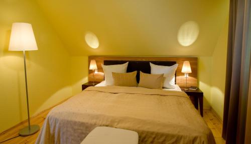 Letto o letti in una camera di Hotel Habichtstein