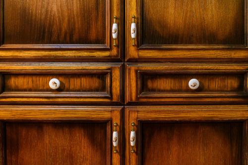a set of wooden cabinets with wooden doors at Gasthof zum Jägerwirt in Mariazell