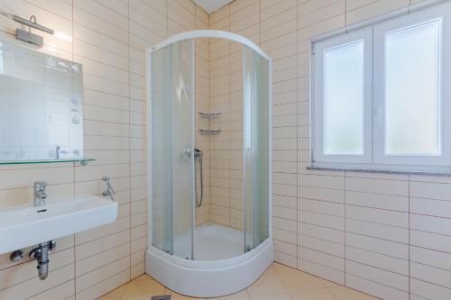 a bathroom with a shower and a sink at Holiday house Barbara in Supetar