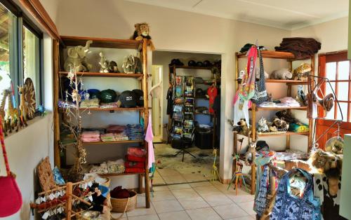 a room filled with shelves filled with lots of items at Sibuya Game Reserve and Lodge in Kenton on Sea