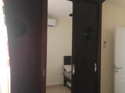 an open door to a room with a bedroom at Mohamed Afifi Stella Heights - Sidi Abdel Rahman - Families - 3 Bed rooms in El Alamein