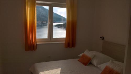 Posteľ alebo postele v izbe v ubytovaní Apartman Zaklopatica