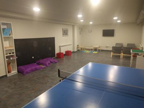 a room with a ping pong table in it at Aparthotel La Vall Blanca in Vielha