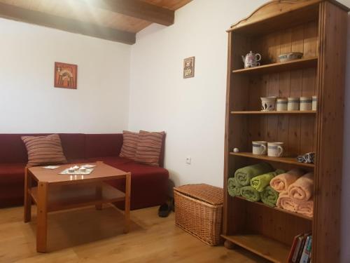 a living room with a couch and a table at Hrncirna in Klenovice