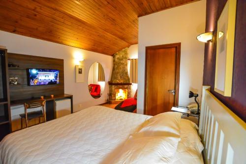 Ένα ή περισσότερα κρεβάτια σε δωμάτιο στο Pousada Ana Terra