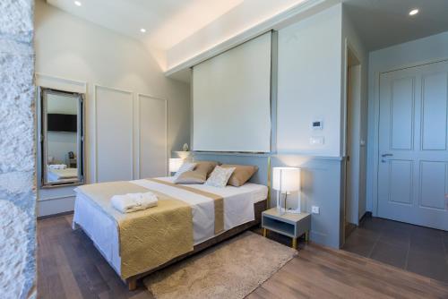 a bedroom with a bed and a large window at Riva Palace in Split