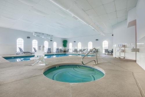 a swimming pool in a large white room with a swimming pool at Hawthorn Suites Las Vegas in Las Vegas