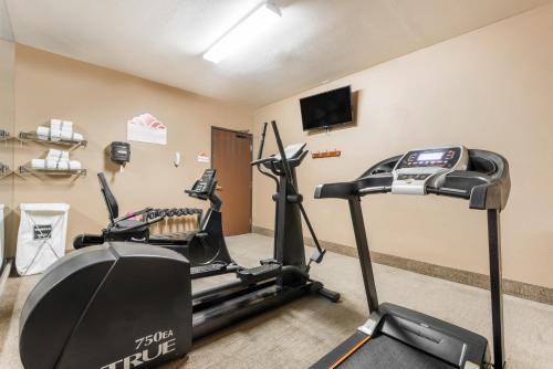 a gym with two exercise bikes and a television at Hawthorn Suites Las Vegas in Las Vegas