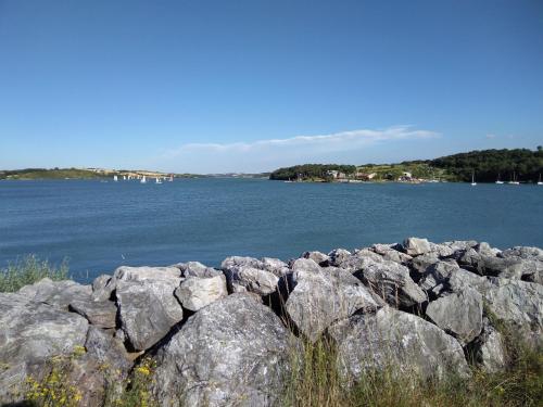 a group of rocks in front of a body of water at Chambres d'Hôtes d' En Jouti in Avignonet-de-Lauragais