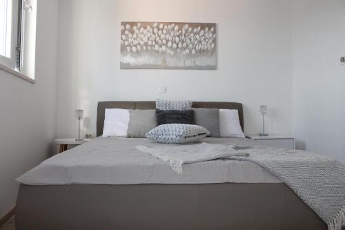 Кровать или кровати в номере Apartments Platana
