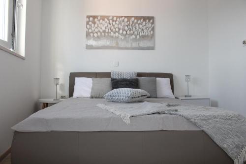 Posteľ alebo postele v izbe v ubytovaní Apartments Platana