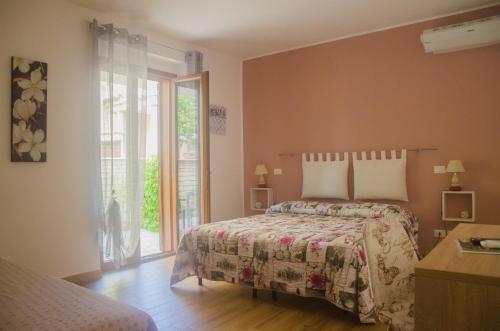Postel nebo postele na pokoji v ubytování Baia Benessere B&B Eco Vegan
