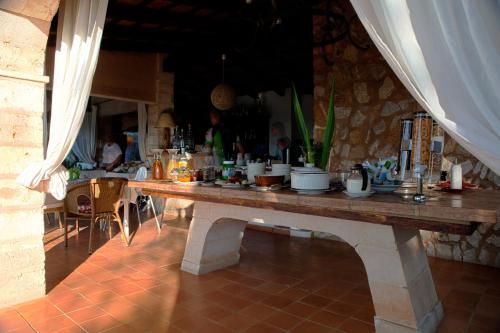 a table with pots and pans on top of it at El Encinar de Arta in Artá