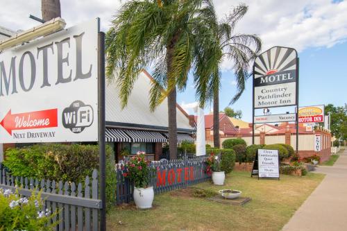 a motel sign in front of a building at Country Pathfinder Motor Inn in Dalby