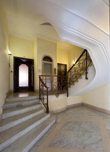 an archway in a building with stairs and aoyer at 50 SUITE Guesthouse in Naples