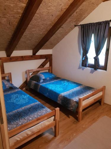 Posteľ alebo postele v izbe v ubytovaní Kuća za odmor "Gećat"