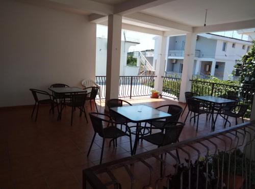 a group of tables and chairs on a patio at Apartmani Dado in Ulcinj