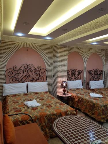 Postel nebo postele na pokoji v ubytování Hotel Salsabil