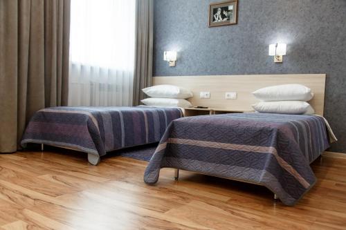 Ένα ή περισσότερα κρεβάτια σε δωμάτιο στο Hotel Amurasso