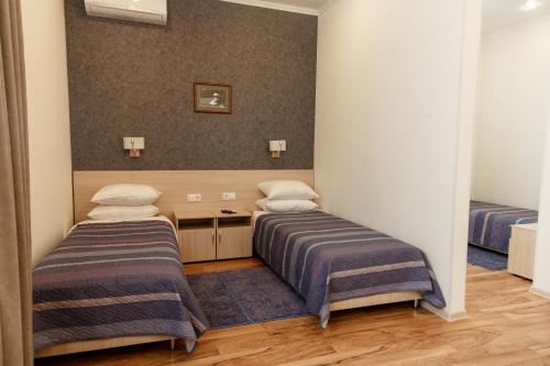 Ένα ή περισσότερα κρεβάτια σε δωμάτιο στο Hotel Amurasso