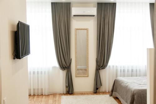 Ένα ή περισσότερα κρεβάτια σε δωμάτιο στο Hotel Amurasso