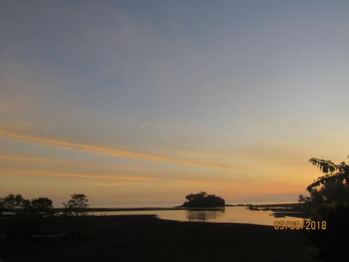 a view of a river at sunset at Posada Ecoturística El Valle in El Valle