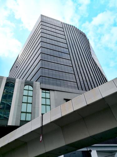 a tall office building with a sky at Imperial Regency Suites & Petaling Jaya in Kuala Lumpur