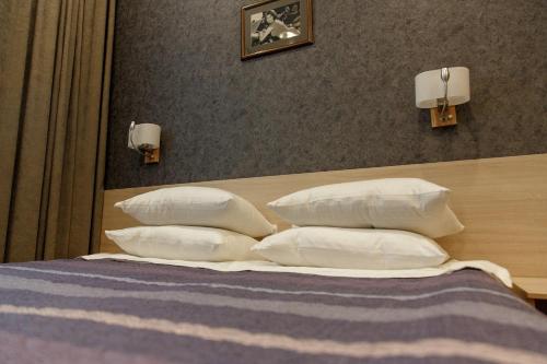Ένα ή περισσότερα κρεβάτια σε δωμάτιο στο Hotel Amurasso