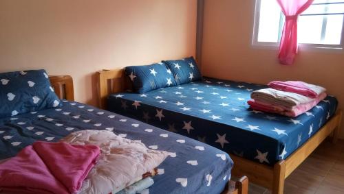 Postel nebo postele na pokoji v ubytování Mon View Doi
