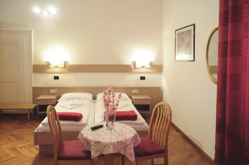 Postel nebo postele na pokoji v ubytování Albergo Casagrande