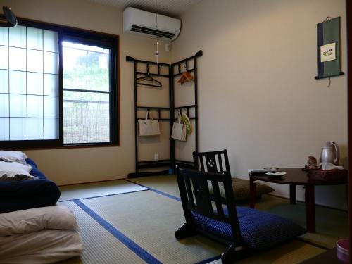 Postel nebo postele na pokoji v ubytování Guesthouse Engawa