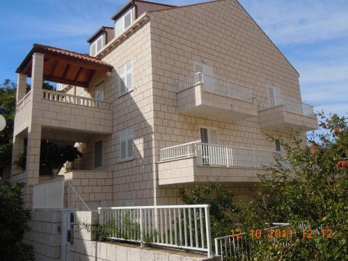 a building with balconies on the side of it at Central Apartment Dubrovnik in Dubrovnik