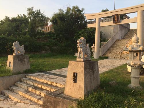 a set of stairs with statues of cats on them at Body Balance House in Miyako Island