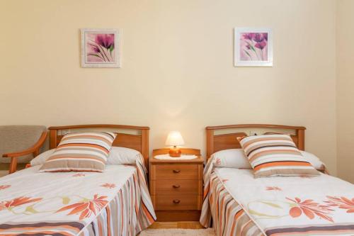 A bed or beds in a room at Casa Pauli