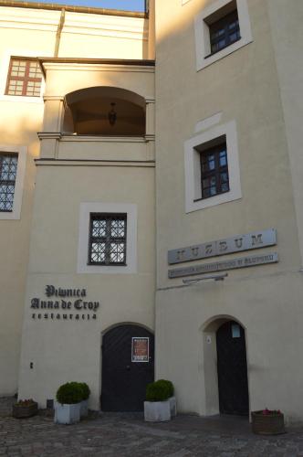 a building with a sign on the side of it at Apartament Park in Słupsk