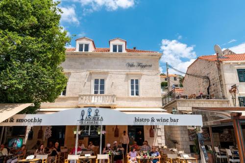 a restaurant in front of a building at Boutique B&B Villa Faggioni in Cavtat