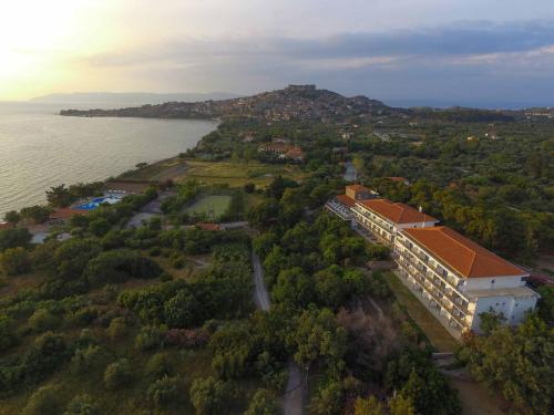an aerial view of a building next to the water at Delfinia Hotel & Bungalows in Mithymna