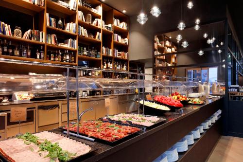 a buffet line with many different types of food at Hotel SB Icaria in Barcelona