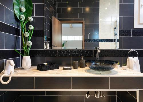 a bathroom with a sink and a mirror at Caretta Village in Toroni