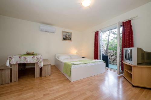 Postel nebo postele na pokoji v ubytování Guesthouse Šime