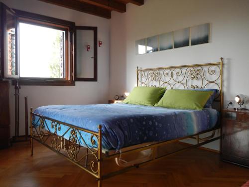 Ein Bett oder Betten in einem Zimmer der Unterkunft B&B Via Punta 8